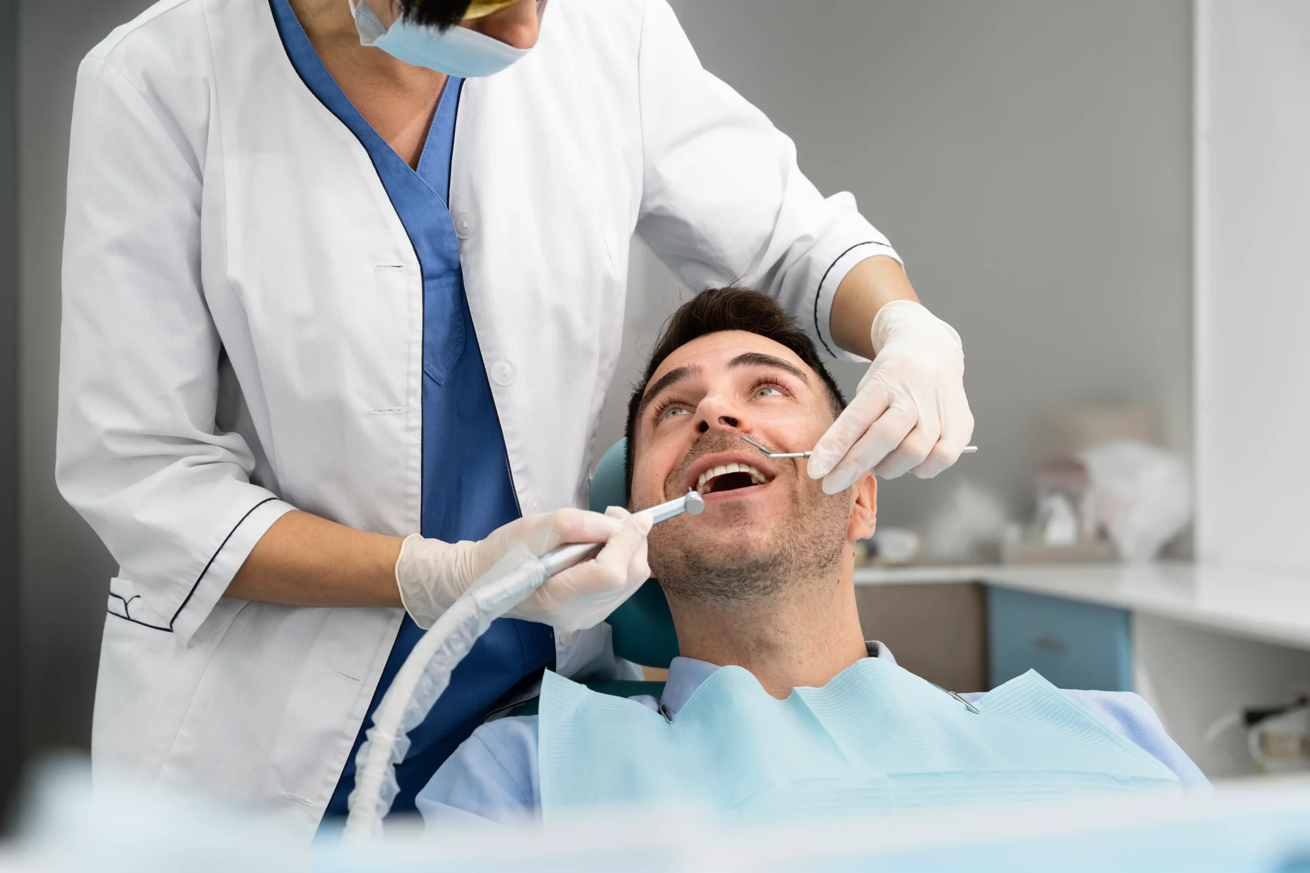 dentist doing check up patient scaled